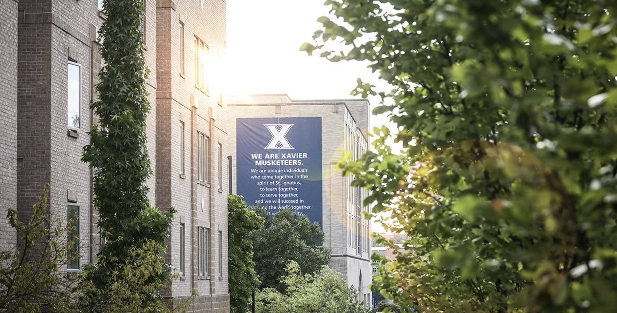 Photo of Xavier Campus that has a view of a building with sun