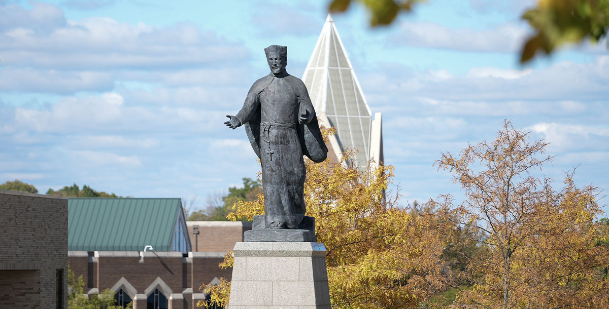 Photo of statue on Xavier Campus