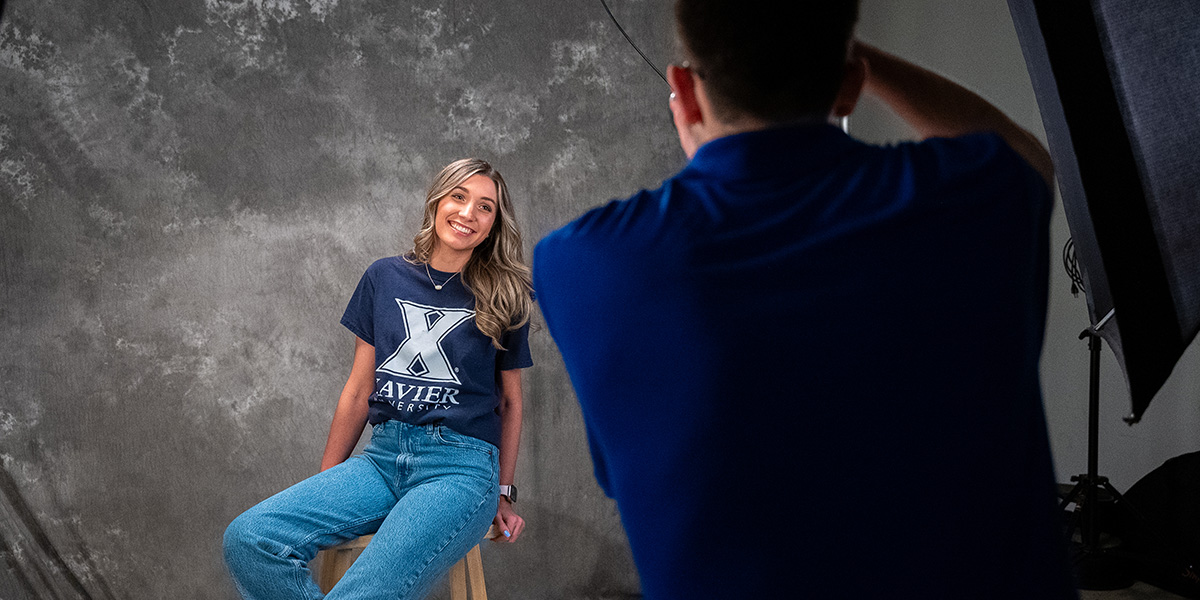 A Xavier Blob Squad student getting their photo taken.