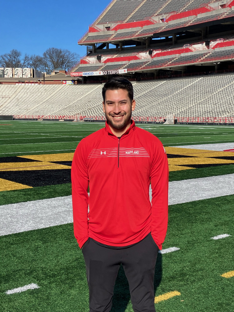 Photo of Noah Kells out in front of a football stadium