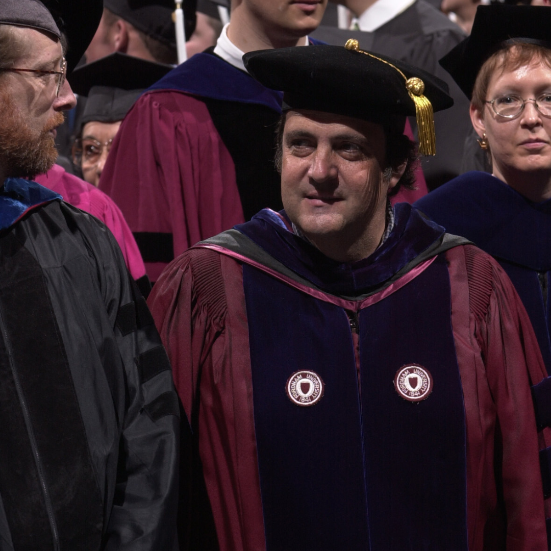 Paul Colella in maroon robes at commencement