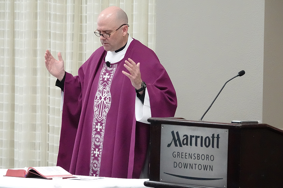 Fr. Bill Murphy, S.J. leads worship in Greensboro for the Xavier community in town for the 2023 NCAA Tournament