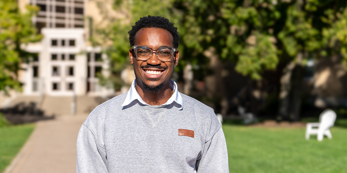 A Xavier student smiling on campus 