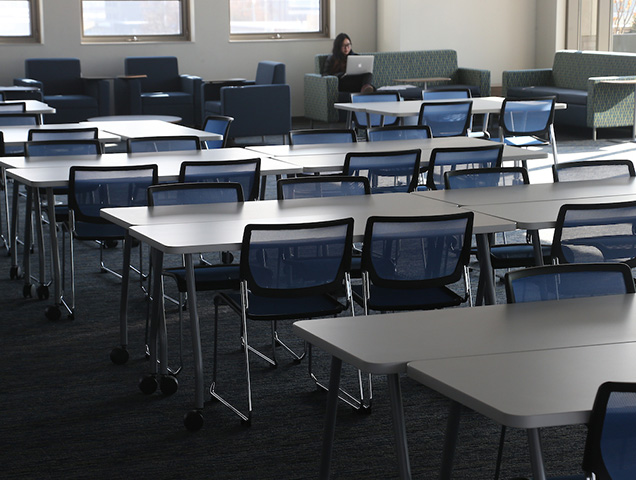 Empty desks and chairs in a classroom