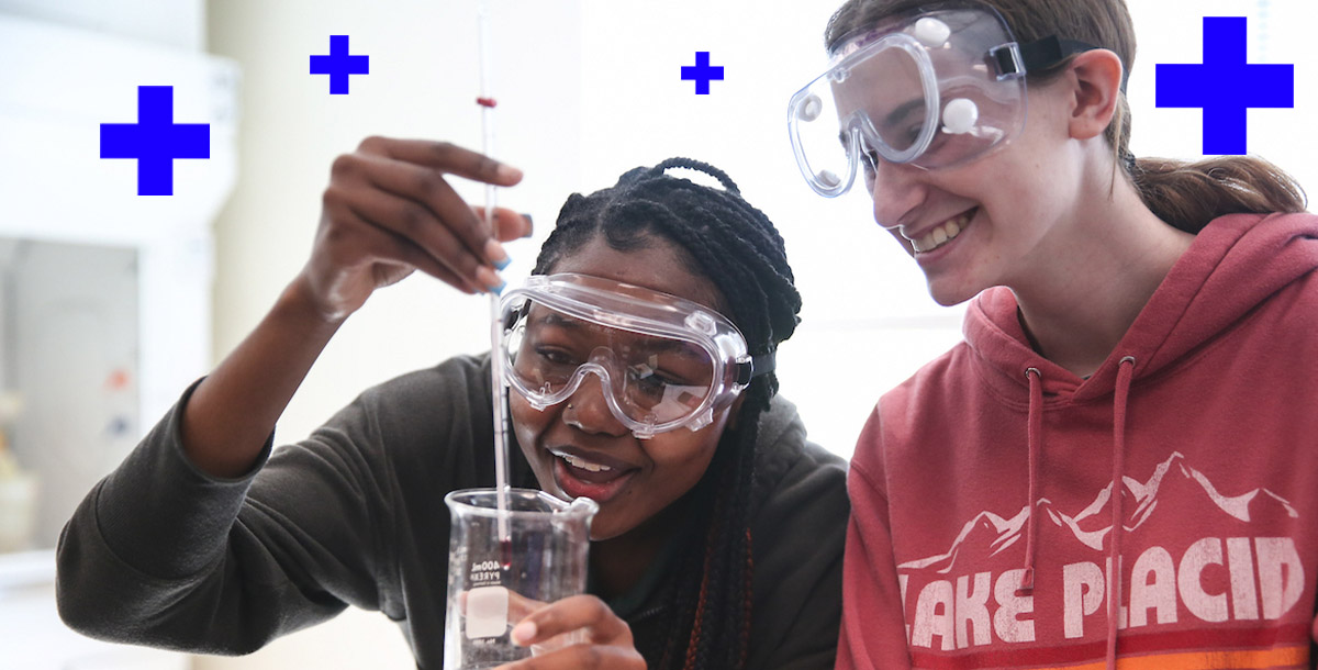 students wearing goggles performing experiment